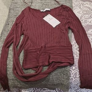 Burgundy long sleeve blouse.